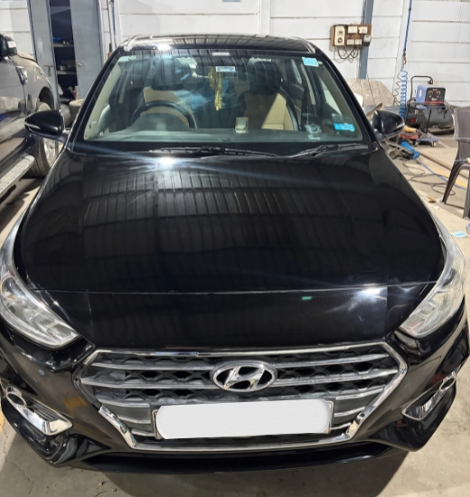 Luxury car undergoing professional dent repair and body painting in PCMC at Auto Clinic using computerized colour matching and premium paint technology.