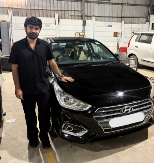 Professional technician performing car denting and painting in PCMC at Auto Clinic with precision body repair and premium paint finishing.